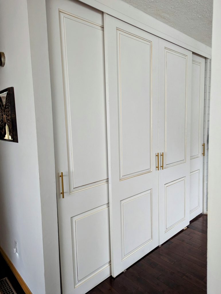 Closet with 4 bypass doors on 2 tracks